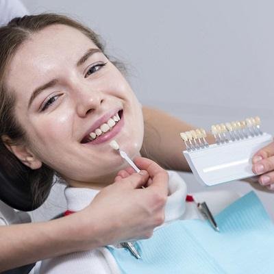 Can you bite into things with veneers in Islamabad?